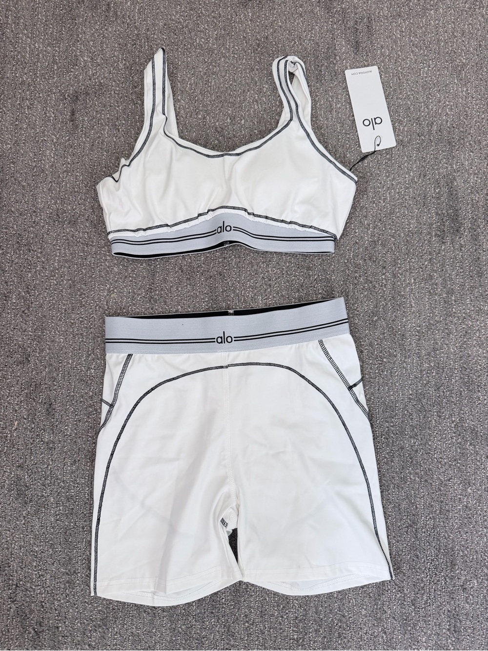 ALO Yoga White Sports Bra and High-Rise Shorts Set with Black Trim